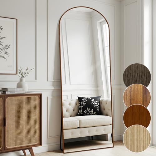 Elegant Melodieux arched mirror with walnut finish enhancing a modern living room interior.